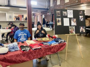 On left is Hook Elite coach and member, Wayne, and member, Andrew Sylvester. Both were on hand at Saturday’s Tabby’s Tales Vendor Fair, offering information about and selling merchandise from their 401 Washington Street, City of Newburgh site boxing program.