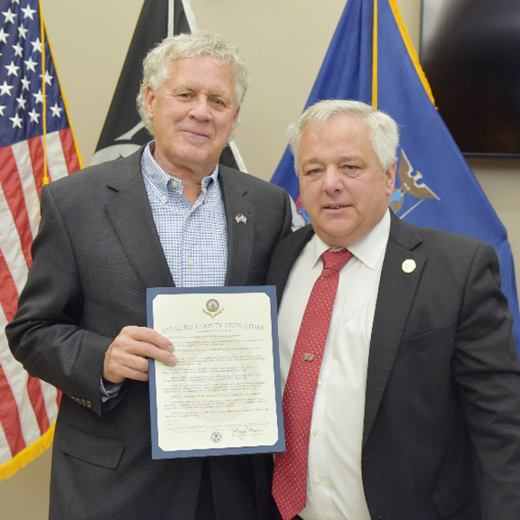 County Executive William F.X. O’Neil (left) received a commendation from the Dutchess County Legislature, which was presented by Legislature Chairman Gregg Pulver (right).