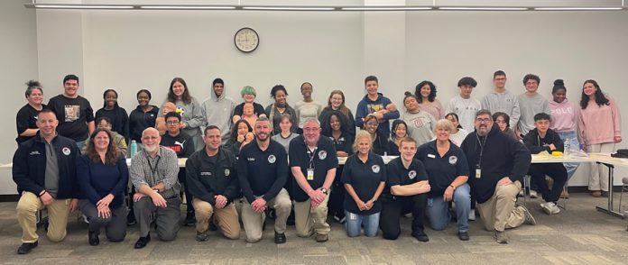 Orange County Executive Steven M. Neuhaus and Commissioner of Emergency Services Peter J. Cirigliano II (center) with students who participated in the CPR training on December 28th.