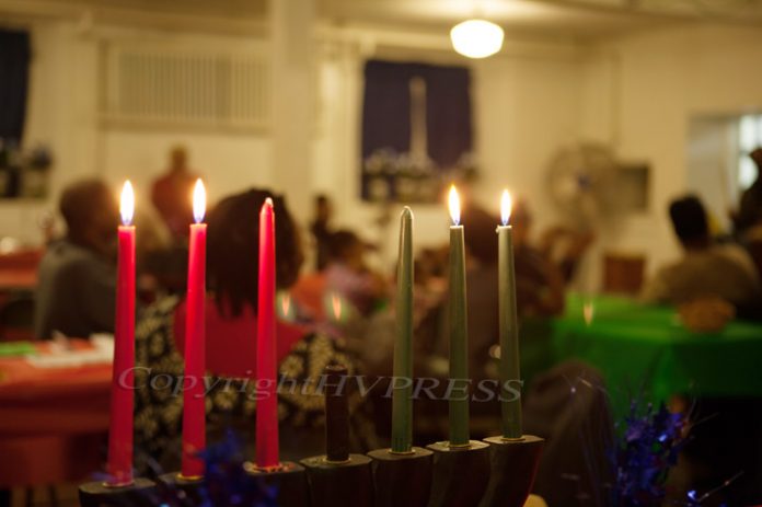 Kwanzaa 2023: Embracing Tradition, Unity, and Renewed Purpose was the theme as many people celebrated the cultural holiday, which includes lighting candles for each of the seven principles. Hudson Valley Press File/CHUCK STEWART, JR.