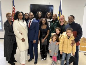 Councilmember Robert McLymore poses with his family after his Swearing In Ceremony at the City of Newburgh Recreation Center.