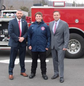 Orange County Commissioner of Emergency Services Peter J. Cirigliano II, Firefighter 1 graduate Tyler Purta of the Village of Florida and Orange County Executive Steven M. Neuhaus.