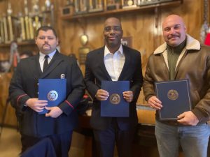 From left are; Wappingers Falls Fire Department Captain, Alex Bravo;  Raquan White and another Fire Captain who were each honored at Thursday’s ceremony for their valiant very first responder efforts at the November 2, 2023 gas explosion incident in the Village of Wappingers Falls. 