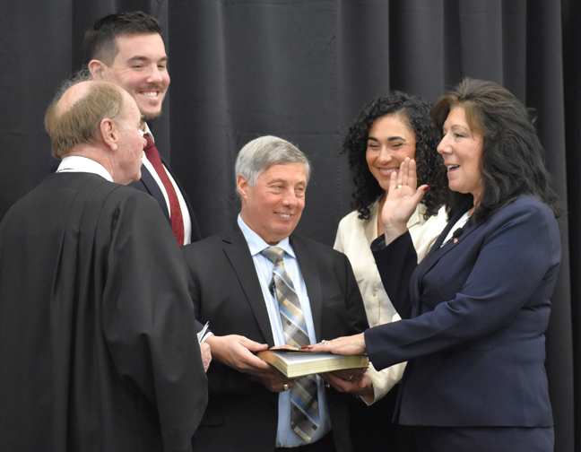 The Honorable Judge Brands administers the ceremonial Oath of Office to County Executive Sue Serino as she is joined by her husband Mark (center) and her son Anthony and daughter-in-law Kaela.