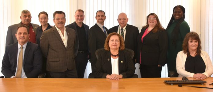 The new Sullivan County Legislature includes, standing from the left, District 6 Legislator Luis Alvarez, District 9 Legislator Terry Blosser-Bernardo, District 7 Legislator Joseph Perrello, District 1 Legislator Matt McPhillips, District 3 Legislator Brian McPhillips, District 4 Legislator Nicholas Salomone Jr., District 5 Legislator Catherine Scott and District 8 Legislator Amanda Ward; and seated center, District 2 Legislator Nadia Rajsz, who also was elected Chair. Seated next to her are Sullivan County Manager Joshua Potosek and Clerk to the Legislature AnnMarie Martin.