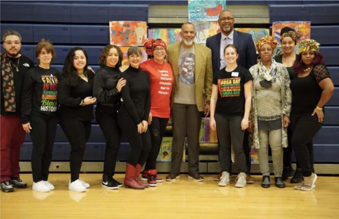 From Left to Right: Gibert Colon, Lorraine Boughton, Lesley Rodriguez, Jessica Ortiz, Jessica Hettinger, Natasha Brown (Executive Director), Kevin Douglass Greene, Superintendent Dr. Eric Rosser, Jules Lindquist, Helen Purnell, Justinne Rodriguez, Charm Blaze pose for a photo.