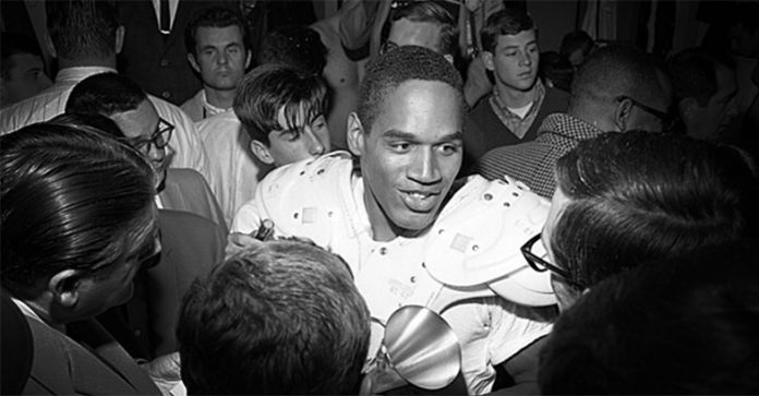 O.J. Simpson talking to reporters in 1967.