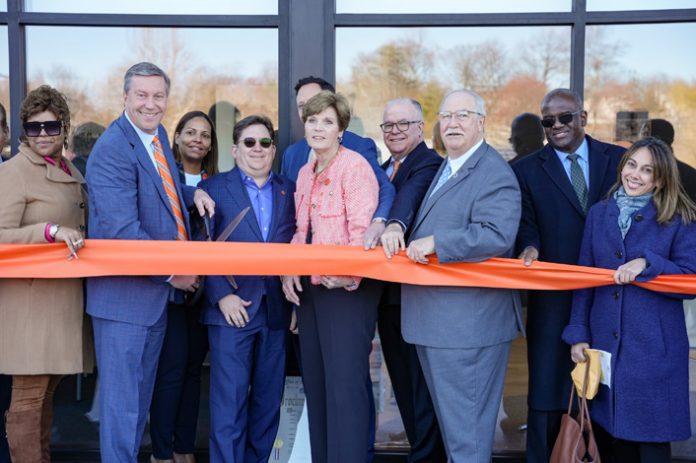A ribbon cutting ceremony for the new Orange Bank & Trust Company branch location in Yonkers. Pictured L to R: Yonkers City Council member Tasha Diaz; Orange Bank & Trust Company President and CEO Michael Gilfeather; Assistant Relationship Manager Lisbet Acuna; Chairman of the Board, Jonathan Rouis; Moira Kiernan, Vice President and Relationship Manager; Joseph Ruhl, Executive Vice President and Westchester Regional President; Yonkers City Council Minority Leader Mike Breen; Westchester Deputy County Executive Ken Jenkins; and City of Yonkers Deputy Communications Director Lisa Reyes.