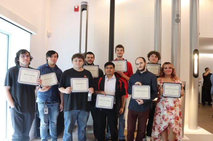 Graduates from Hudson Valley Pathways Academy pose for a group photo at their completion ceremony which took place on Thursday, May 30 at the Selux Corporation in Highland, NY.