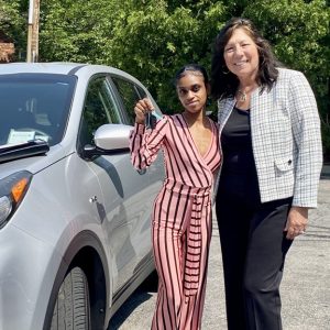 County Executive Sue Serino (left) presented “Way to Work” participants, such as Charity, keys to the vehicles they’ve earned by completing the program.