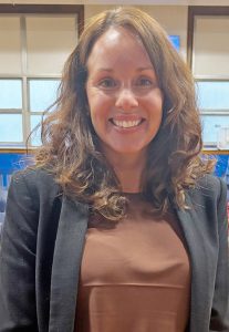 Holly Sanford accepted her new position as the Executive Director of School Business at the Board of Education Meeting.