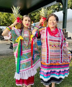 Dancers pose for a photo during La Guelaguetza 2025.