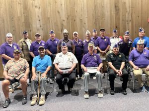 Some of the many past Purple Heart recipients who were on hand for Saturday’s Purple Heart Appreciation Day gather together at The National Purple Heart Hall of Honor.