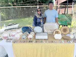 On left, Noreen Asif and her husband, Rafa Asif, were one of several vendors on hand at Saturday’s Community Day Fun event, held at City of Newburgh’s Masjid Al- Ikhlas event.The Asif’s business, Noor Resin Studio, located in Newburgh, features all hand-crafted; car hangings, book marks, wall decor and resin calligraphy.