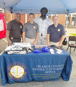 Orange County's District Attorney's Office poses for a photo at Newburgh's 36th National Night Out.