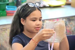 Nearly two-dozen fifth-graders at Hamilton School spent a class Friday stitching Mexican embroidery as part of Hispanic History Month - and they were hooked – literally.