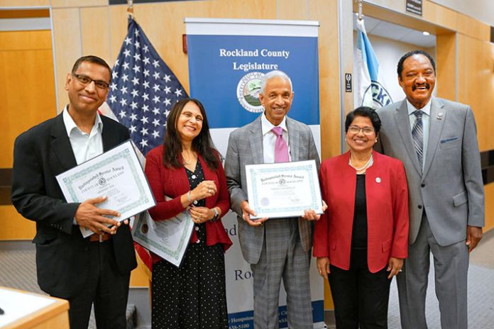 County Legislators Aney Paul and Toney Earl recognize Abhineet Jha, Alka Shah and Joseph Vaniapillil for their many contributions to the community and their personal achievements.