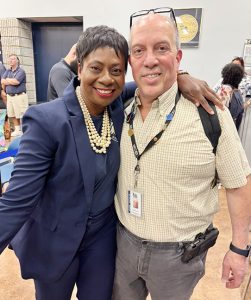 Superintendent Dr. Jackielyn Manning‑Campbell poses for a photo with Board Member Mark Levinstein after the special school board meeting to re­instate her.
