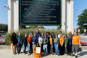 The Feeding Westchester team assembles under the Jumbotron outside the County Center for Hunger Action Day. Photo: Feeding Westchester