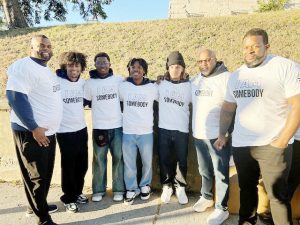 Students from Newburgh Free Academy’s My Brother’s Keeper, along with their mentors, gather on 300 Broadway prior to their March, commemorating the 30th year anniversary of the Million Man March.