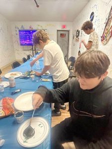 Participants at Friday’s Family-Based Youth/Teen Grief & Loss event make River Stones, dedicated to someone who that person lost, one of the many strategies relayed to assist with the grieving process.