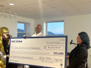 Kevin White smiles big as he accepts the generous contribution from Pat Ryan at Thursday’s Opening Ceremony for the organizations new facility on 74 Broadway in the City of Newburgh.