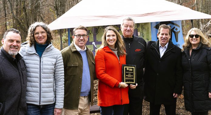 More than 40 community leaders, supporters, and partners gathered last week at Jeffery Court for the land dedication ceremony of Hope Springs Development, Ulster County Habitat for Humanity's groundbreaking 10-home community. From left to right: Fred Costello, Saugerties Town Supervisor, Jen Metzger, County Executive of Ulster County, Michael Barrett, NYS Habitat for Humanity CEO, NYS Senator Michelle Hinchey, Bob Siracusano, owner of Sawyer Motors, Kevin McLaren, Commercial Banking Market President, Hudson Valley Credit Union and UCHFH Board Treasurer, Christine Brady LaValle, UCHFH CEO/Executive Director.