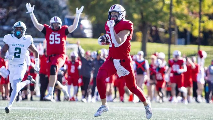 Marist_Connor Hulsein Connor Hulstein scores a 78-yard touchdown while Devin Kennedy (95) celebrate. Photo: Emily Portnov