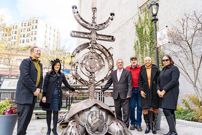 Yonkers Parks, Recreation & Conservation Commissioner Steve Sansone; President Shannon Holsey, Stockbridge-Munsee Band of Mohican Indians; Mayor Mike Spano; Sculptor Al Wadzinski; Yonkers City Councilwoman Deana Norman; Yonkers City Councilwoman Tasha Diaz with the newly installed “Many Trails” sculpture at Daylighting II at 2 Mill Street) Photo: Maurice Mercado