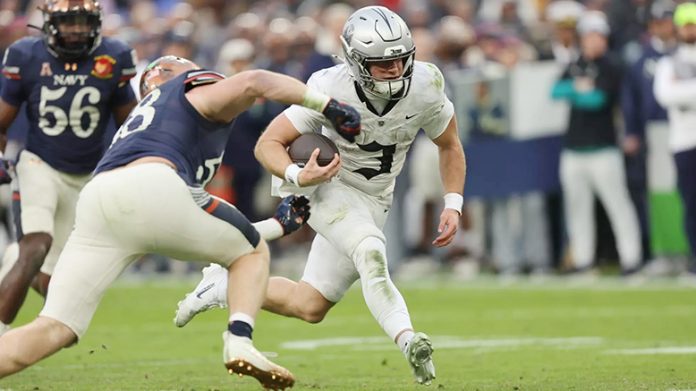 Army QB Cale Hellums rushed for 100 yards, the first 100-yard rusher in the Army-Navy Game for Army since Raymond Maples' 156-yard effort in 2012. Photo: Danny Wild