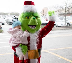 The Grinch greeted children and adults to the Third Annual Healthfirst Holiday Celebration on Saturday. Hudson Valley Press/CHUCK STEWART, JR