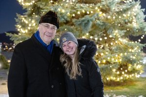 Fr. Gregoire Fluet, Vice President for Mission and Ministry, celebrates with a Mount Saint Mary College student at the annual Tree Lighting festivities. Photo by Lee Ferris.