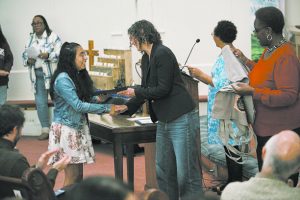 Ulster County Executive Jen Metzger hands out awards during the Inaugural Sojourner Truth Awards honoring 22 local high school students.