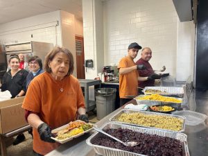 Thursday, at Gallo Hall, inside the Sacred Heart School, Vesuvio’s Ristorante and Papaleo’s Auto Body Inc. once again teamed up for the 8th year to hold their Annual Newburgh Community Thanksgiving Feast, where from 11:30am- 2:00pm, they served close to 100 meals and delivered 300 others, complete with beverages and dessert, giving back to the community they love and have been a part of for over 30 years.