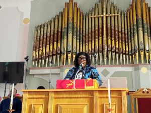 Ms. Kendra Gadsen, part of the Parade Line-up Committee, delivers words at Monday’s MLK Jr. Celebration.