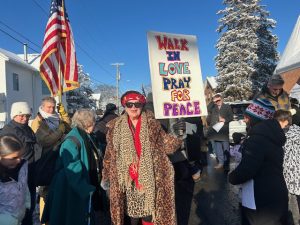 Participants in Monday’s 11th Annual Reverend Dr. MLK Jr. Parade, created by Pete Seeger and his wife Toshi, energetically engage in the two block walk on a chilly, sunny morning, promoting the legacy and Dream of Dr. King at the Reverend Dr. Martin Luther King Jr 47th Annual Birthday Celebration, held at Beacon’s Springfield Baptist Church.
