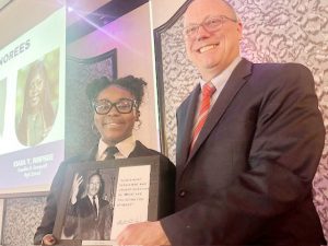 Mia Thomas of Arlington High School, one of three Youth Honorees, with William Harris, Director FDR Presidential Library & Museum.