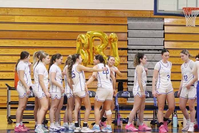 The Mount Saint Mary College women's basketball team honored senior forward Brianna Guglielmo before the Knights' victory over Mount Saint Vincent. Photo: Sabrina Scire
