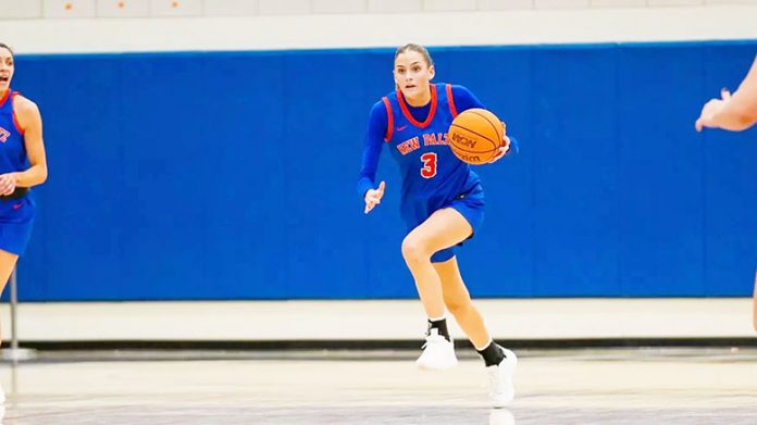 Forward Summer Perry helped her team to a defensive stop, getting her hand on a block, which resulted in a triple by Fitzgerald the other way to give SUNY New Paltz a lead of 16 entering the fourth quarter. Photo: Jacob Hoyos