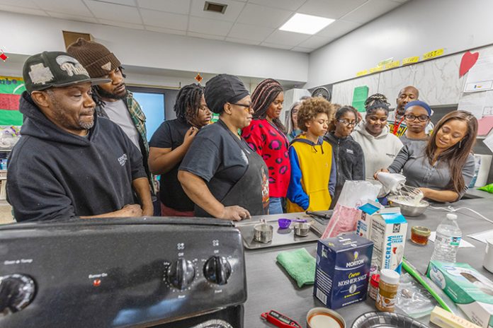 Poughkeepsie students get a taste of the world as celebrity chef brings star-studded culinary experience to local middle school. Photo: Kevin Paige