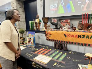 Ada Freeman of Newburgh takes a look at some of the paraphernalia available at Saturday’s Kwanza event.