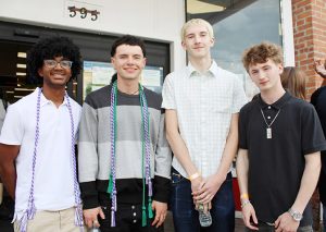 Ulster BOCES graduates from the Kingston City School District, Ruben Derisse (New Visions Robotics & Engineering), Jaden Reposa (Early Childhood Education), Silas Gabler (Automotive Technology), and Preston Clark (Heating, Ventilation & AC), smile together before the Career Pathways Completion Celebration at UPAC on May 28, 2026.