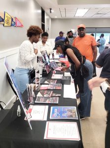 On Left Heaven Cunningham, a graduate of the HBCU, Cheyney University in Pennsylvania and member of the Denson Admission Group, speaks to as well as provides resources to guests at Saturday’s information session.