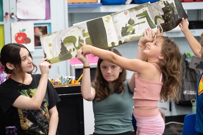 Smart Scholars students delve into fun literacy projects with local children during the summer program, overseen by Janine Bixler, Mount Saint Mary College professor of Education. Photo by Lee Ferris.