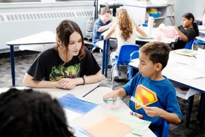 Smart Scholars students delve into fun literacy projects with local children during the summer program, overseen by Janine Bixler, Mount Saint Mary College professor of Education. Photo by Lee Ferris.