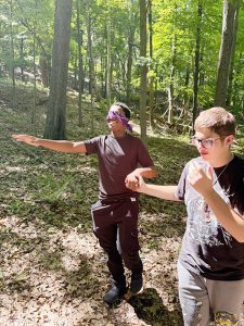 Campers Micah and Gaven from the Town on Poughkeepsie taking part in a sensory and trust building activity at Black Creek Preserve.