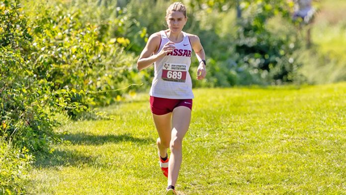 Haley Schoenegge raced around the Washington County Fairgrounds 6K course with a time of 20:49.2, outpacing her previous best of 20:52.3, to earn a first place finish out of 168 total finishers. Photo: Carlisle Stockton