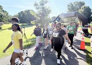 Walkers begin the 3rd Annual Orange Peel to Pavement Fun Run/Walk 5K.