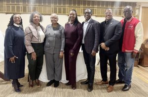 Rev. Dr. Dollyann Newkirk-Briggs, Rev. Saul Williams' daughter Joelle Williams, his wife Juanita Sealy-Williams, his daughter Juliette Williams Pryor and her husband Walter Pryor, Mayor Torrance Harvey, and Bishop Jeffrey C. Woody pose for a photo after the street renaming ceremony to honor the legacy of Baptist Temple Church's founding pastor, Rev. Dr. Saul S. Williams.