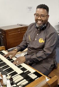 Bishop Dr. James Hassell played the organ as his choir sang at Apostle Jeffrey C. Woody's Pre-Anniversary Celebration.